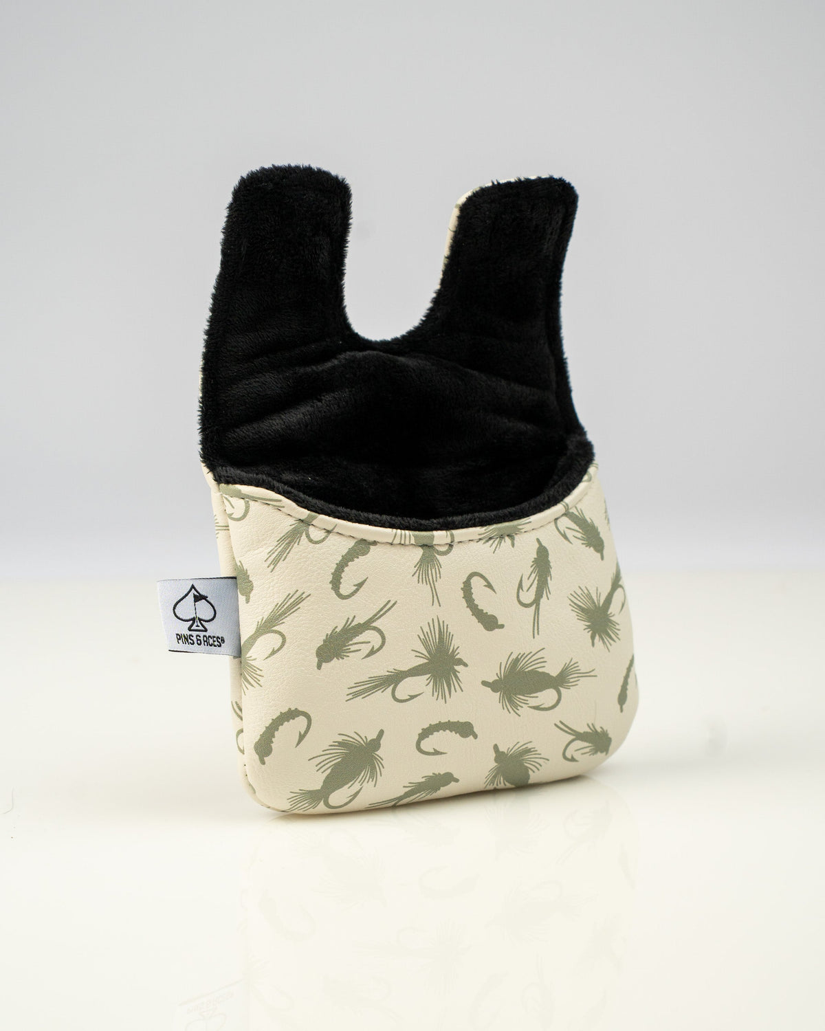 Trout center shaft mallet putter cover featuring a stylish fish pattern and soft black lining for protection.