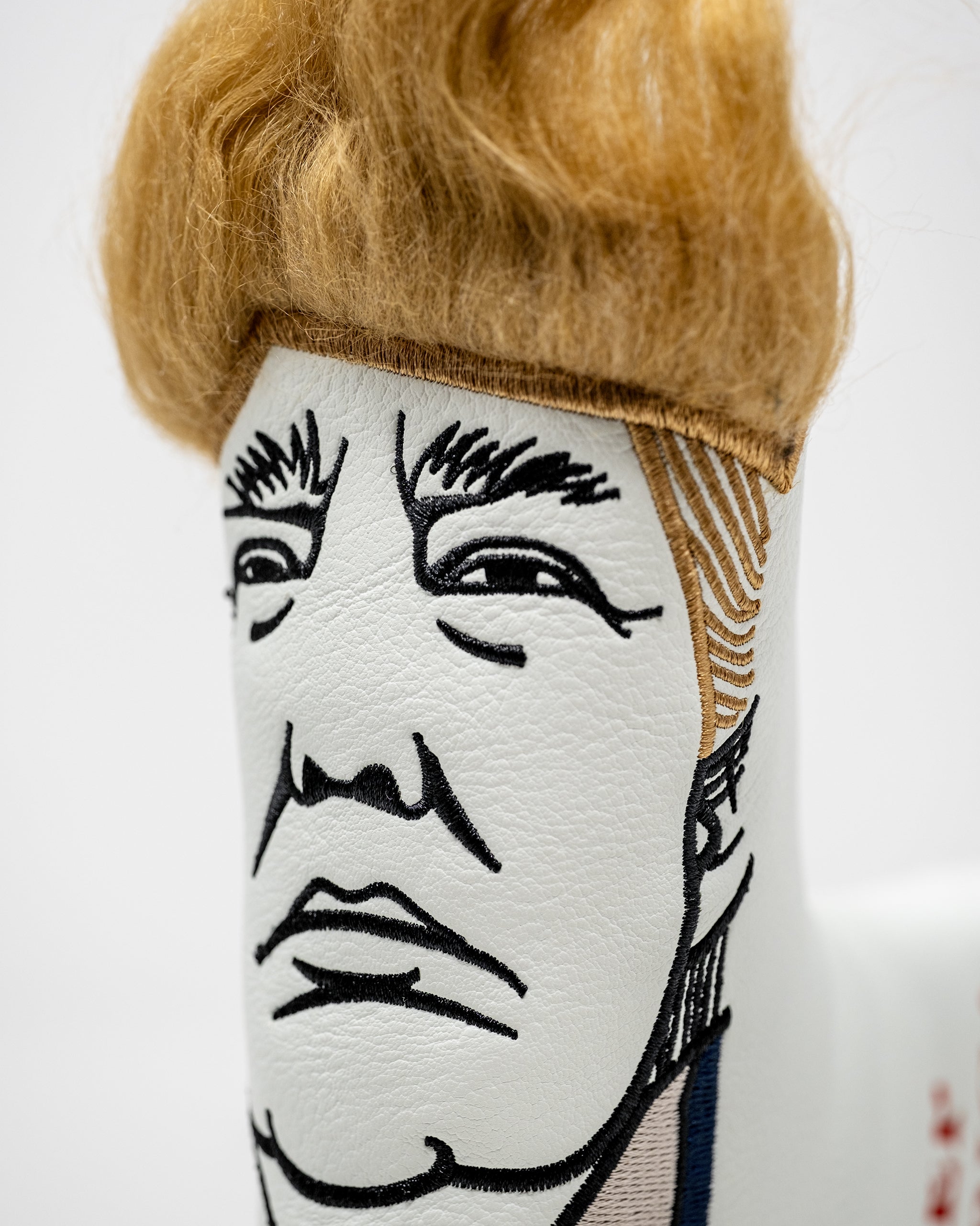 Trump Blade Putter Cover featuring a vibrant design with a caricature of Donald Trump, suitable for protecting golf putters.