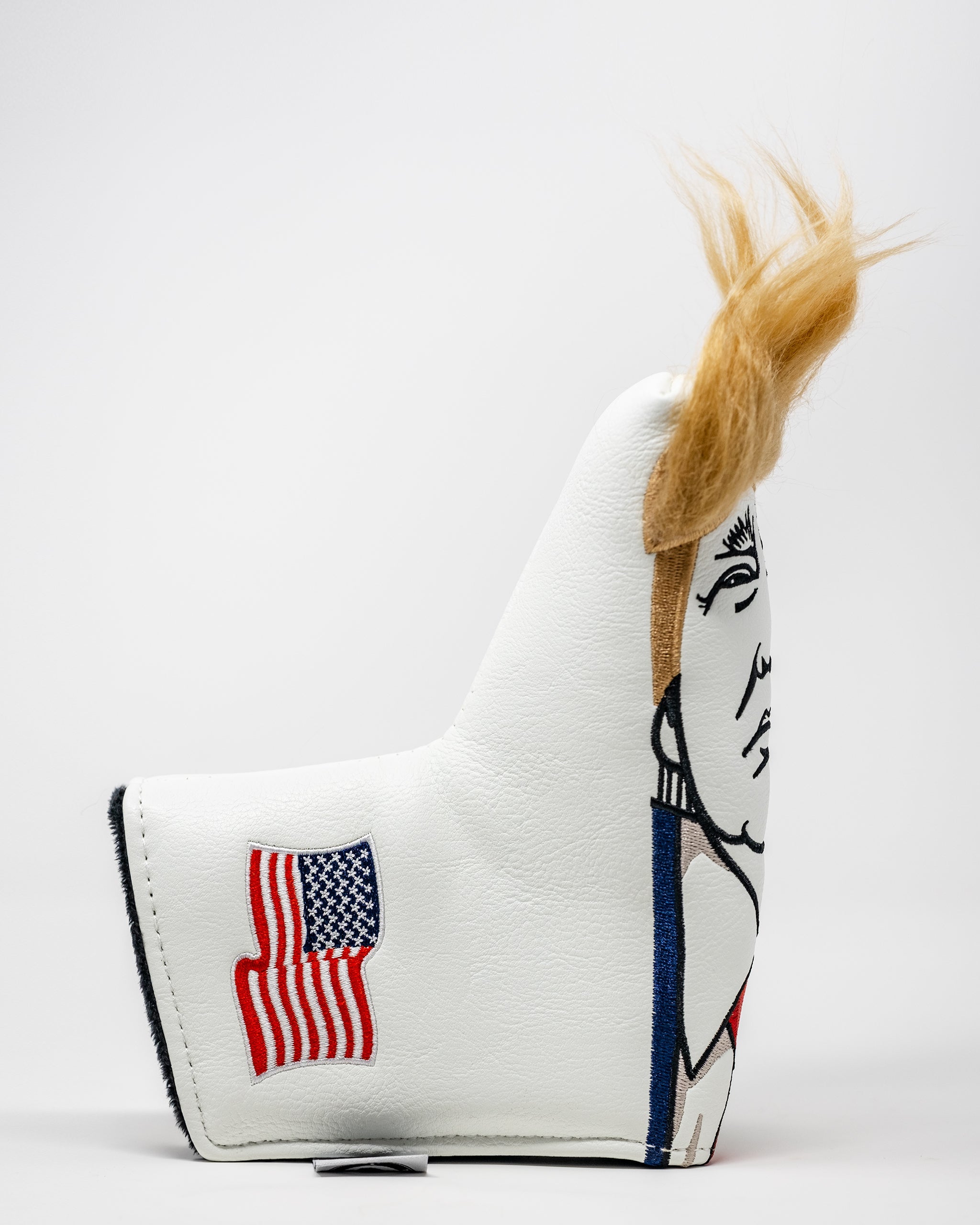 Trump Blade Putter Cover featuring a bold design with vibrant colors and a prominent Trump motif, ideal for golf enthusiasts.