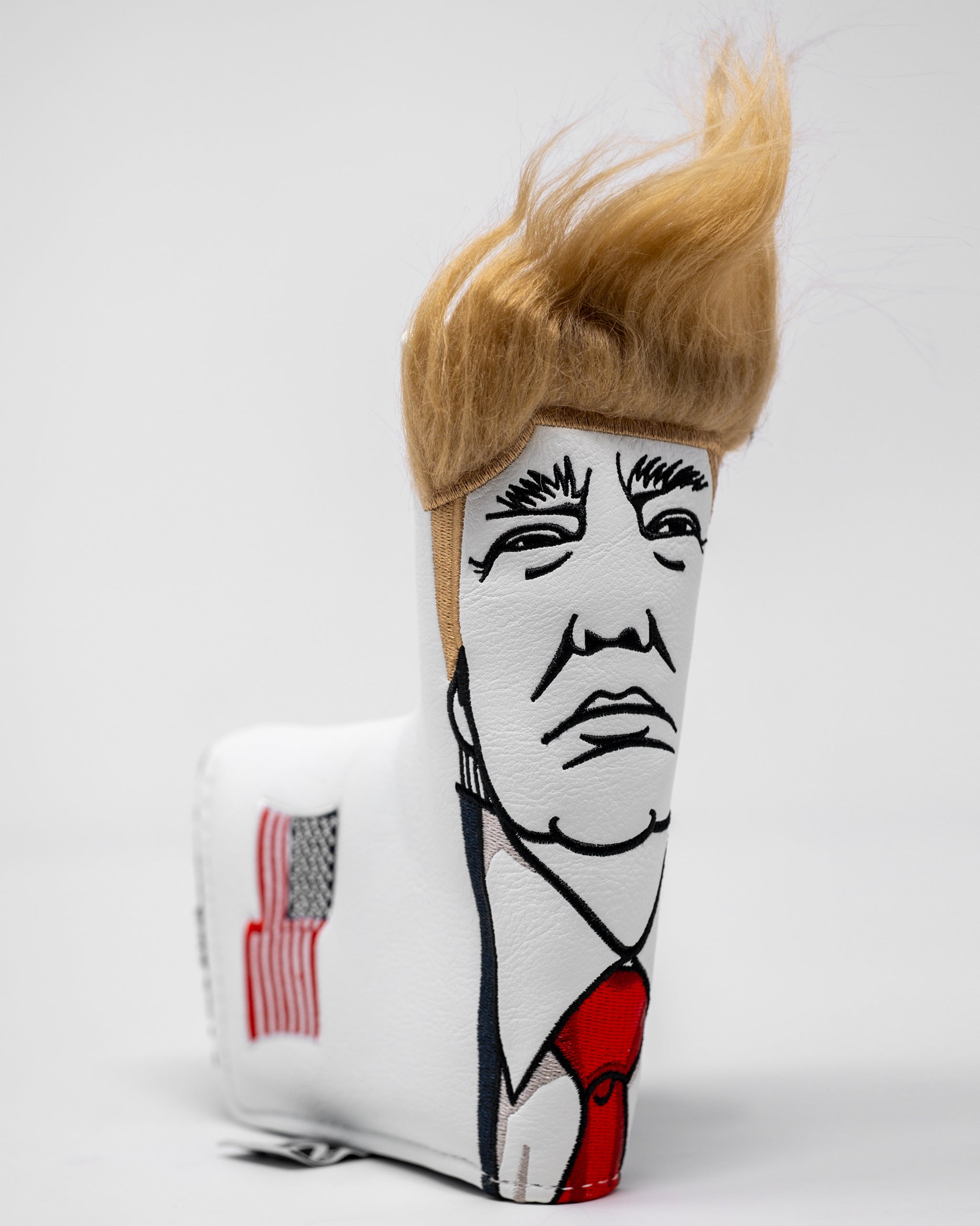 Trump Blade Putter Cover featuring a bold design with a stylish Trump logo, designed for protection and aesthetic appeal on the golf course.