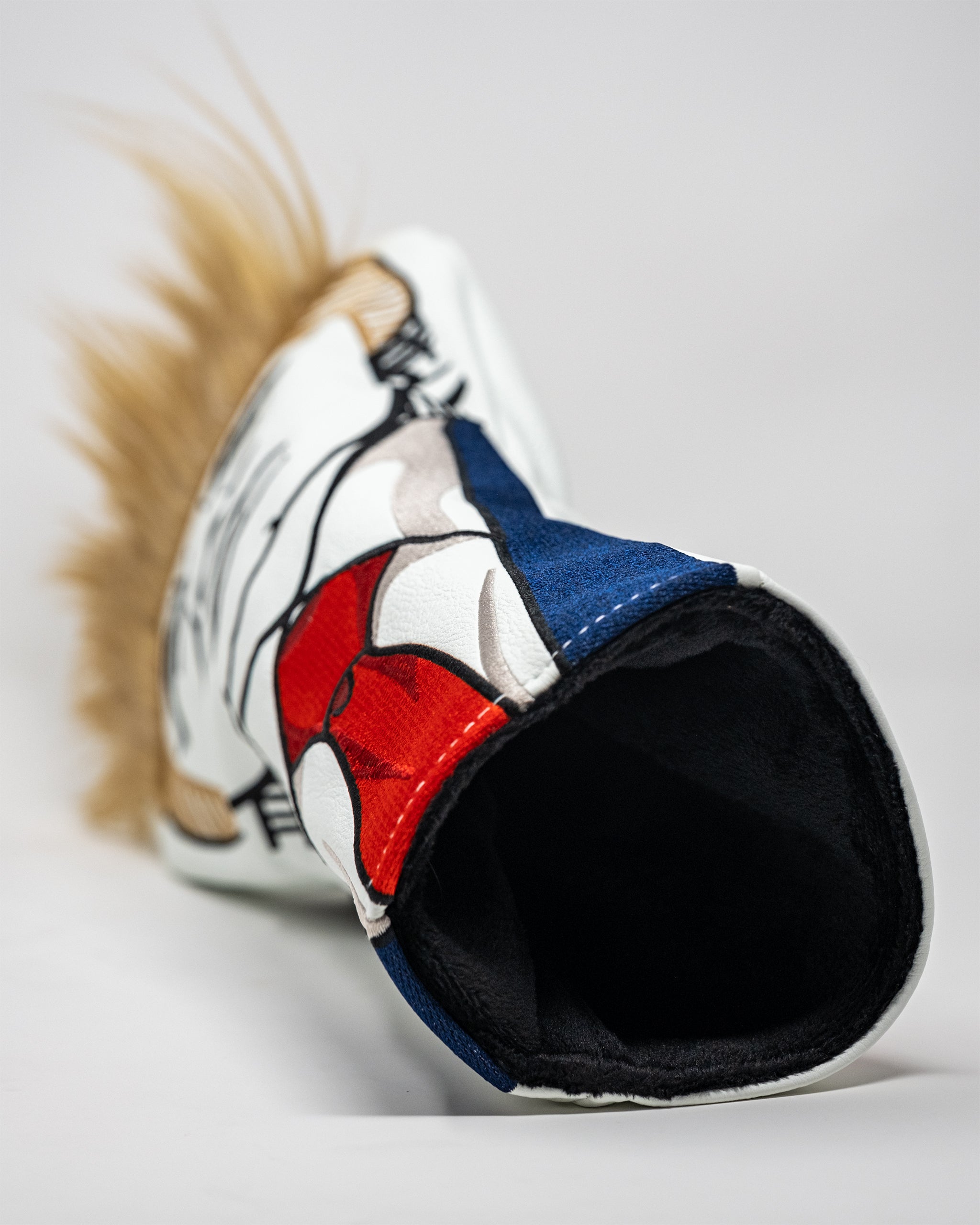 Trump driver cover featuring a detailed illustration of Donald Trump's head with a golf ball, designed for golf enthusiasts.