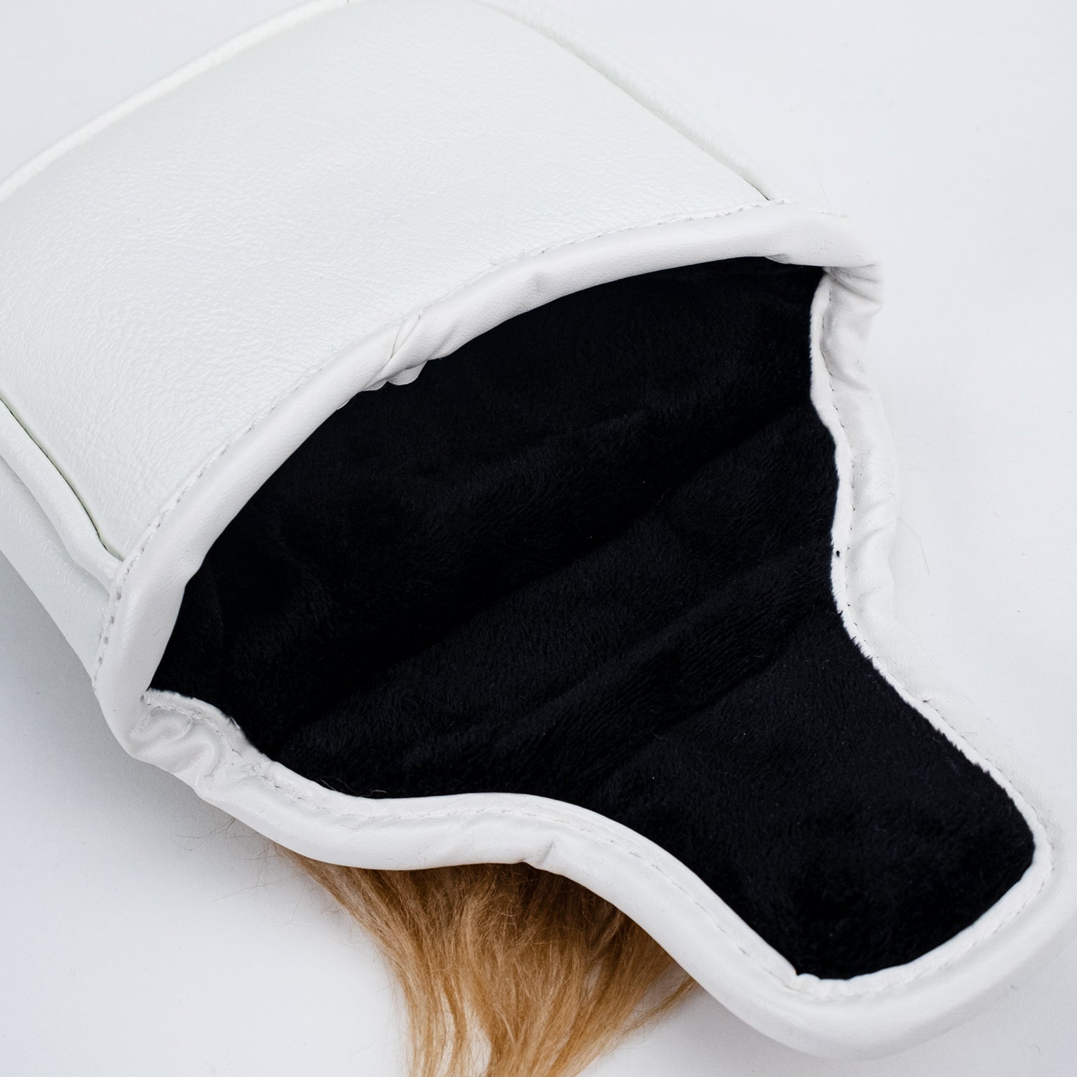 Trump mallet putter cover with an open design, featuring a detailed embroidered logo and high-quality materials for golf clubs.