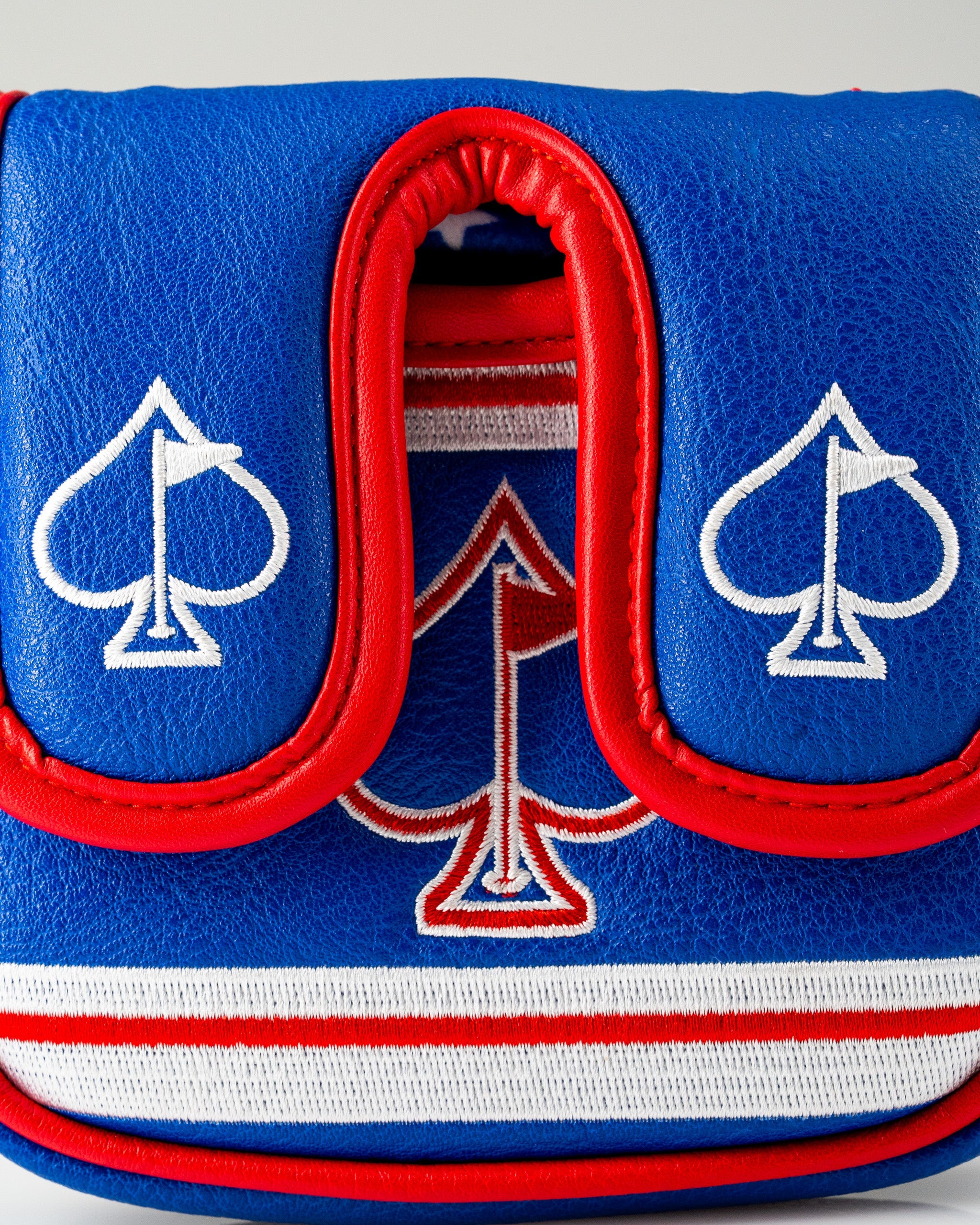 Bold blue mallet putter cover featuring red accents and white spade designs, perfect for patriotic golf enthusiasts.