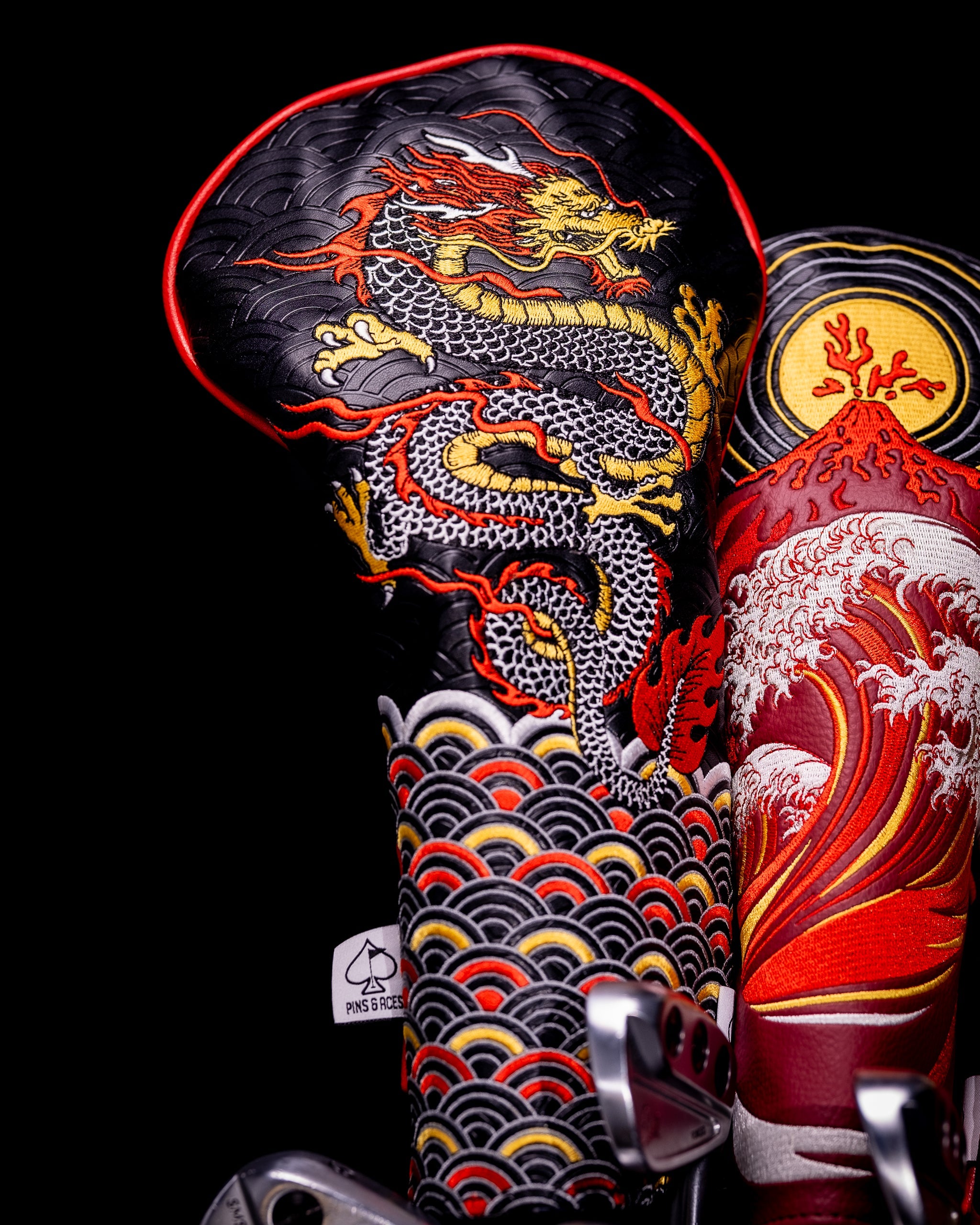 Dragon's Dynasty Driver Cover featuring a sleek black design with intricate dragon graphics, perfect for golf enthusiasts.