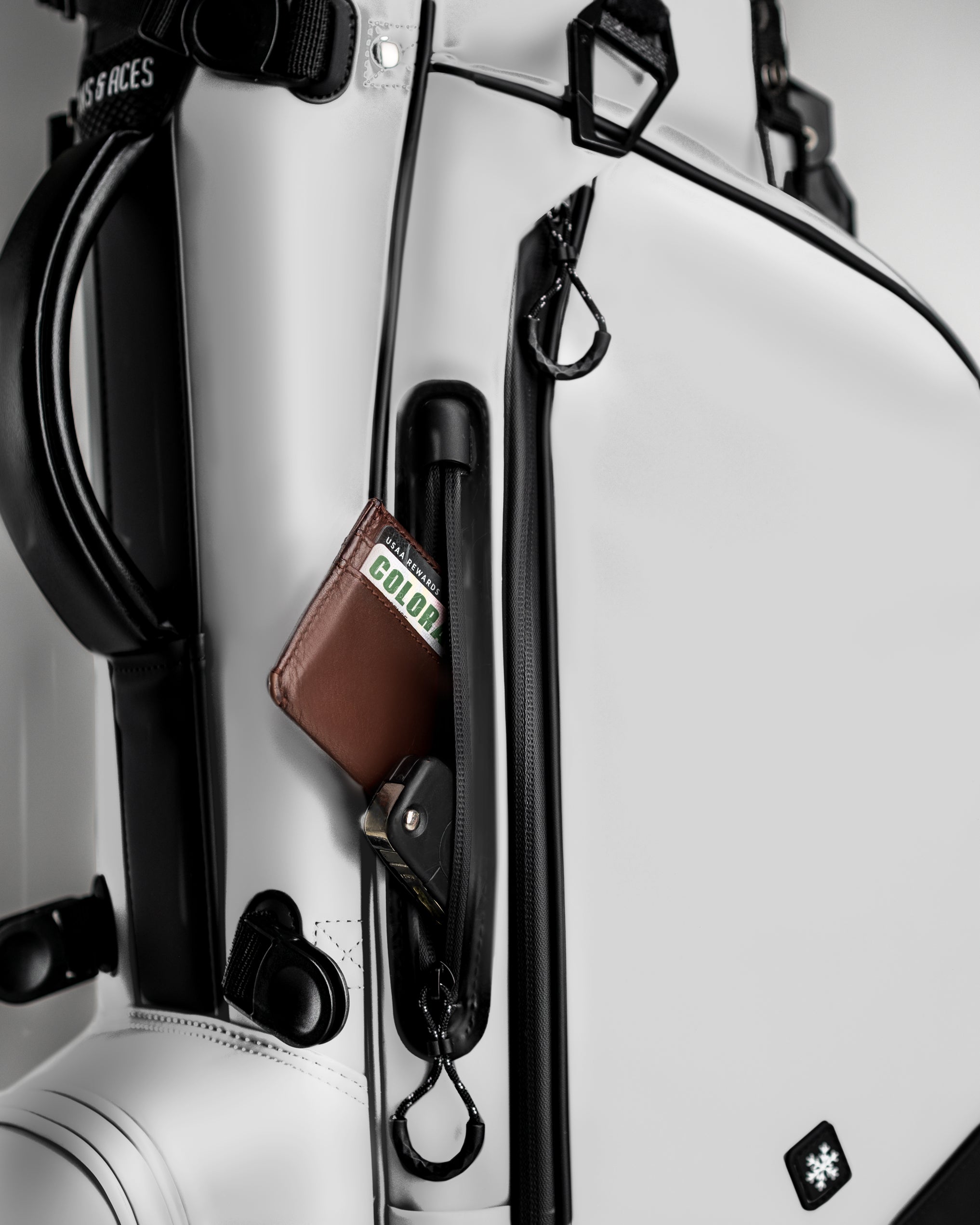 Player Preferred™ Golf Bag in Domino design, featuring a white exterior with ample storage pockets and a padded strap.