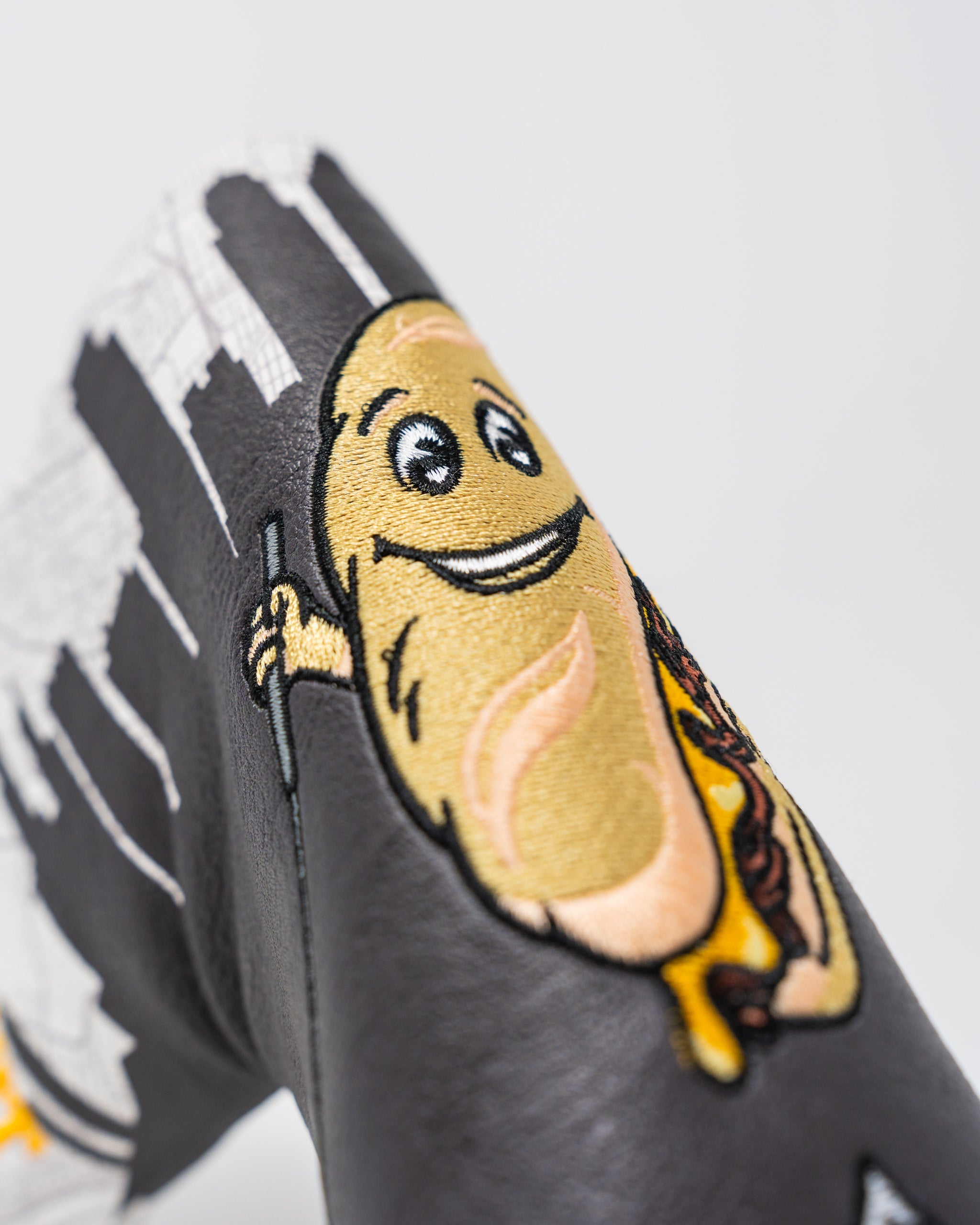 Whiz Wit Blade Putter Cover featuring a sleek design with a distinctive logo and vibrant colors.