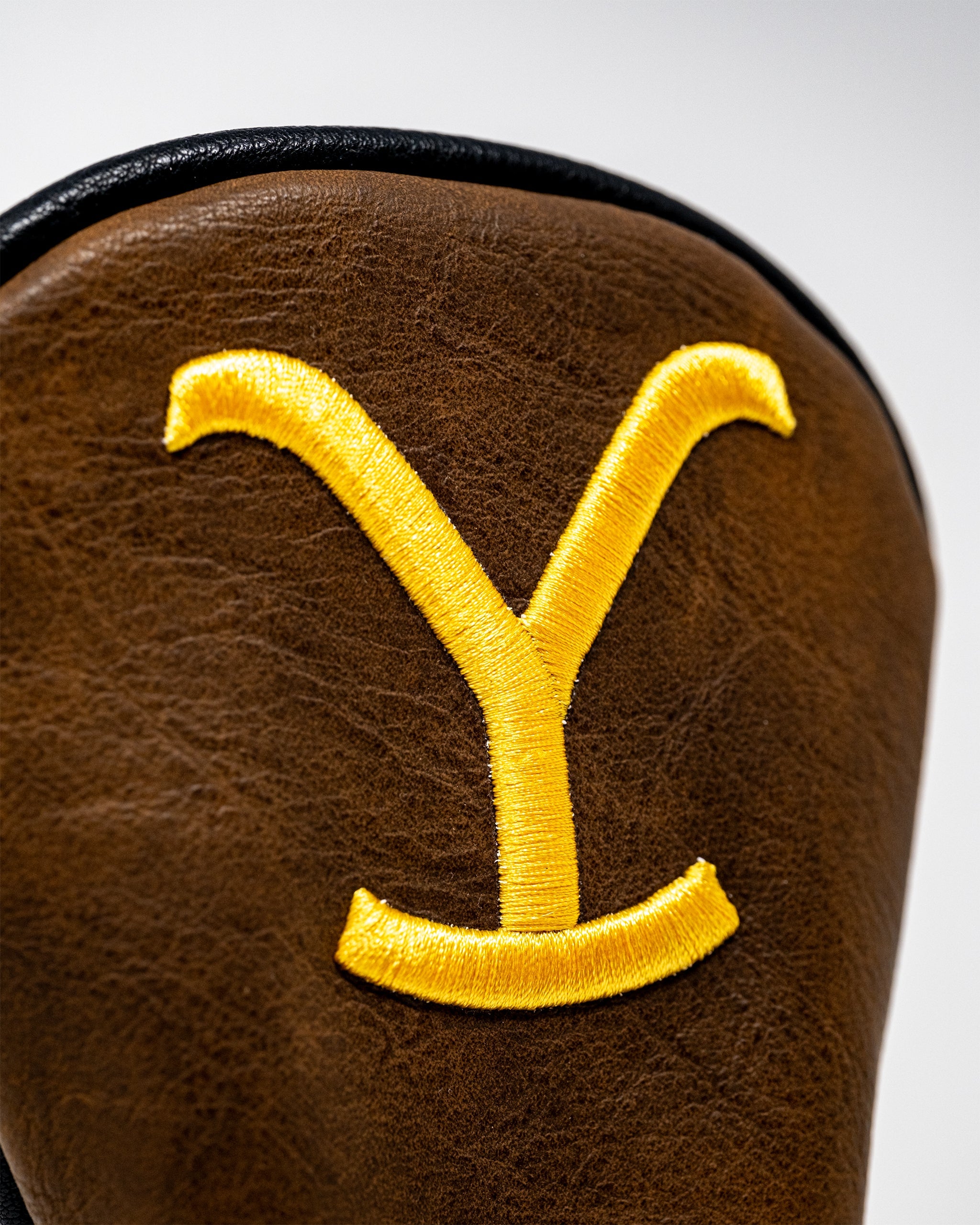 Yellowstone Hybrid Cover featuring a durable design, showcasing vibrant colors and an ergonomic fit for outdoor protection.