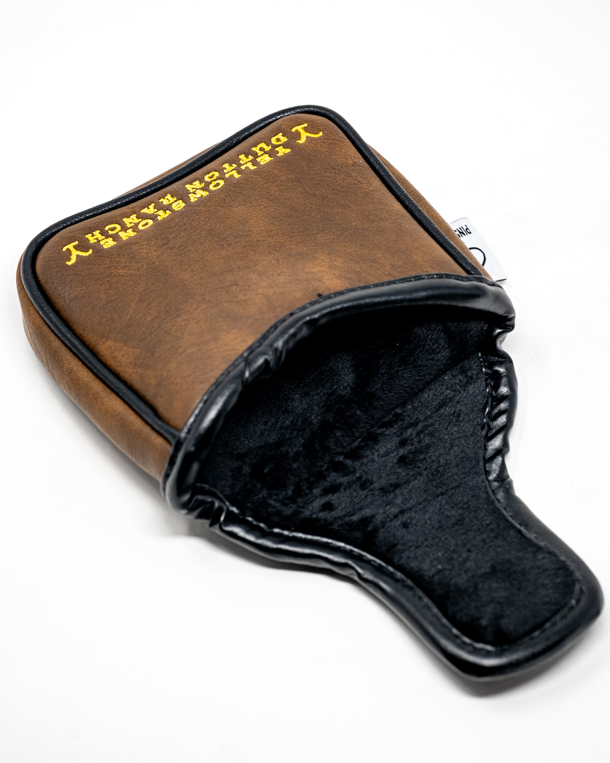 Yellowstone mallet putter cover with a stylish design and vibrant colors, showcasing durable materials and a secure fit.